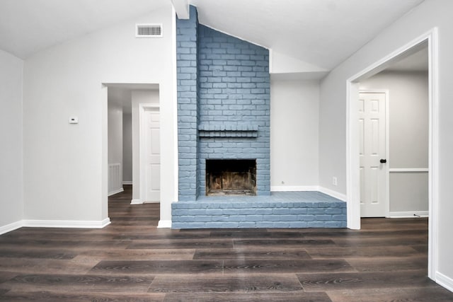 10602 Raydell Dr, Houston, TX 77031 - unfurnished living room with vaulted ceiling, a brick fireplace, and wood finished floors