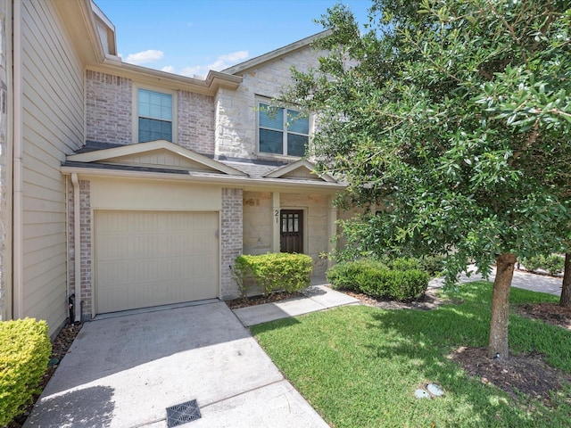16020 Fountainview Dr Unit 21, Montgomery, TX 77356 - multi unit property featuring a garage, concrete driveway, and brick siding
