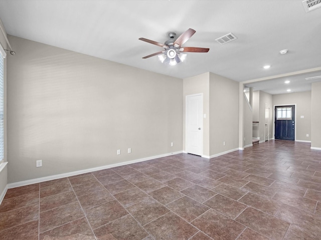 16020 Fountainview Dr Unit 21, Montgomery, TX 77356 - unfurnished room with a ceiling fan, recessed lighting, and dark tile patterned flooring