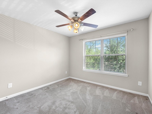 16020 Fountainview Dr Unit 21, Montgomery, TX 77356 - carpeted spare room with baseboards and ceiling fan