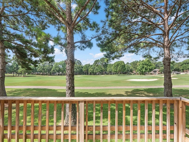 16020 Fountainview Dr Unit 21, Montgomery, TX 77356 - wooden deck featuring a lawn, view of golf course, and view of wooded area