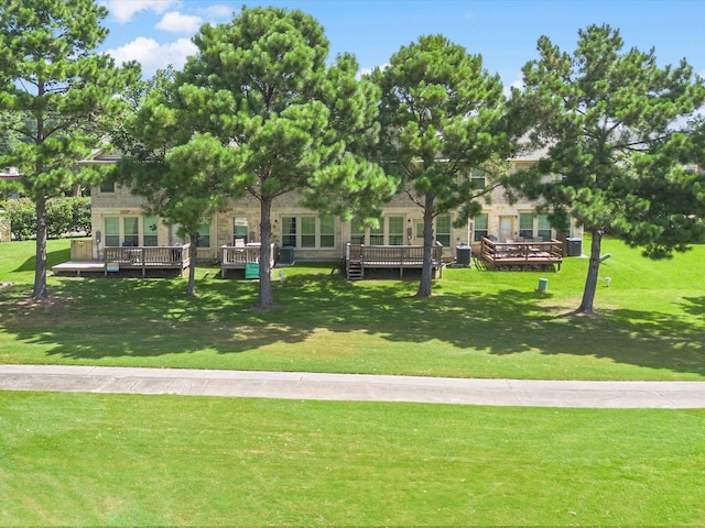 16020 Fountainview Dr Unit 21, Montgomery, TX 77356 - view of community with a deck and a lawn