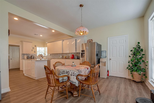 1407 Ella Cir, Houston, TX 77090 - dining area featuring light wood finished floors and recessed lighting