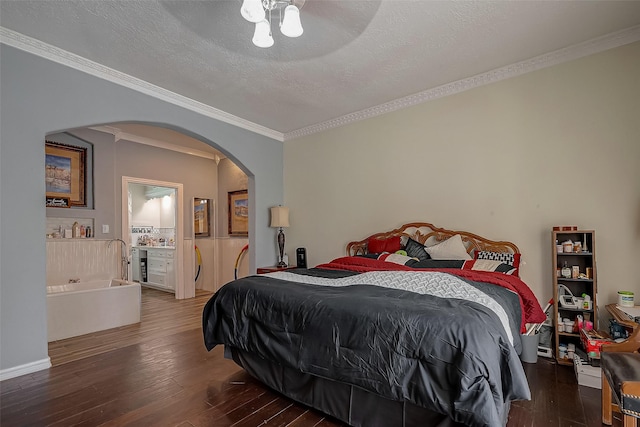 1407 Ella Cir, Houston, TX 77090 - bedroom with arched walkways, wood-type flooring, ornamental molding, and a textured ceiling