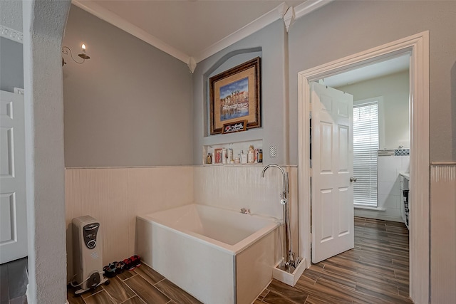 1407 Ella Cir, Houston, TX 77090 - bathroom with a garden tub, wood finished floors, a wainscoted wall, vanity, and crown molding