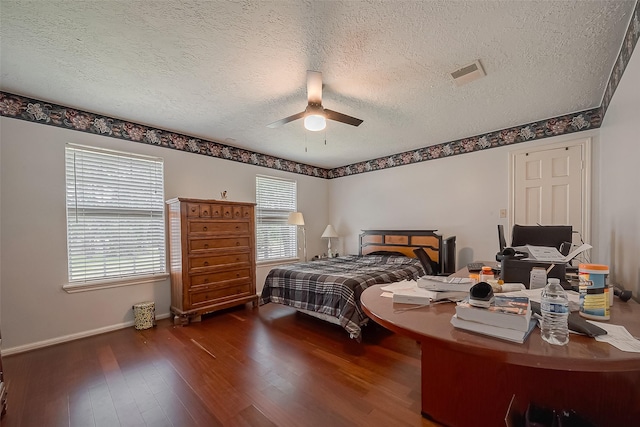 1407 Ella Cir, Houston, TX 77090 - bedroom with a textured ceiling, multiple windows, wood finished floors, and ceiling fan