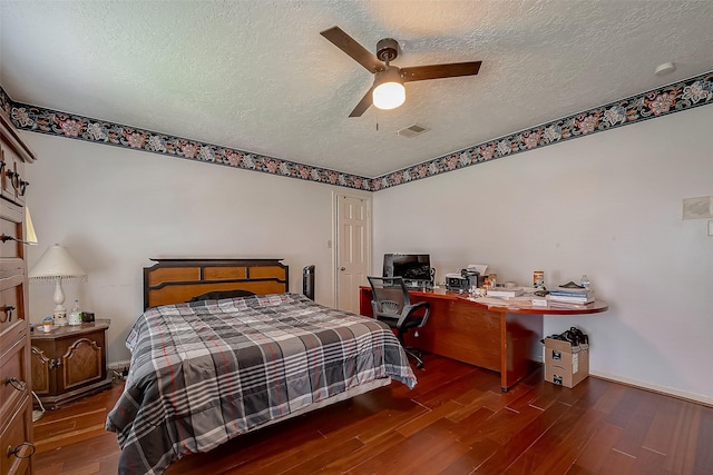 1407 Ella Cir, Houston, TX 77090 - bedroom featuring a textured ceiling, wood finished floors, and a ceiling fan