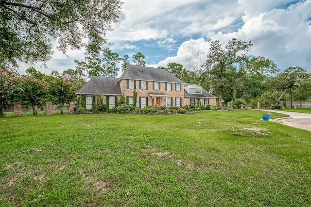1407 Ella Cir, Houston, TX 77090 - colonial inspired home with brick siding