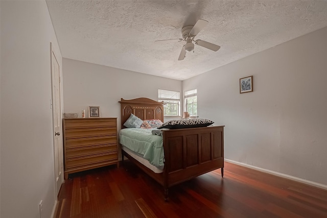 1407 Ella Cir, Houston, TX 77090 - bedroom featuring wood finished floors, a textured ceiling, and a ceiling fan