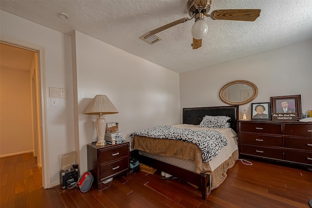 1407 Ella Cir, Houston, TX 77090 - bedroom featuring wood finished floors, a textured ceiling, and a ceiling fan