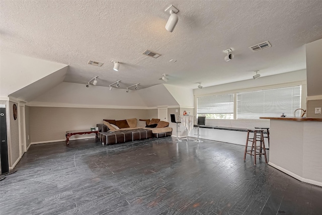 1407 Ella Cir, Houston, TX 77090 - additional living space with a textured ceiling and wood finished floors