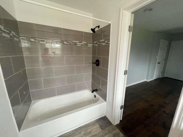 4938 Magnolia Ln, Old River Winfree, TX 77535 - bathroom with tub / shower combination and wood finished floors