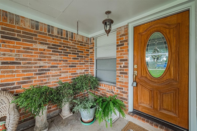 1640 Shepherd St, Hempstead, TX 77445 - property entrance with brick siding and a porch