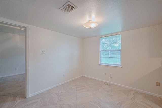 1640 Shepherd St, Hempstead, TX 77445 - spare room featuring a textured ceiling and baseboards