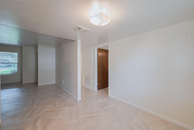1640 Shepherd St, Hempstead, TX 77445 - spare room with baseboards and a textured ceiling