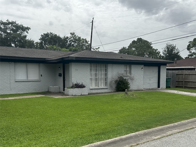 1773 El Mar Ln, Seabrook, TX 77586 - view of front of home with an attached garage, driveway, brick siding, and a shingled roof