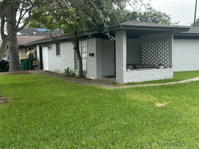1773 El Mar Ln, Seabrook, TX 77586 - rear view of property featuring brick siding, a yard, and a shingled roof