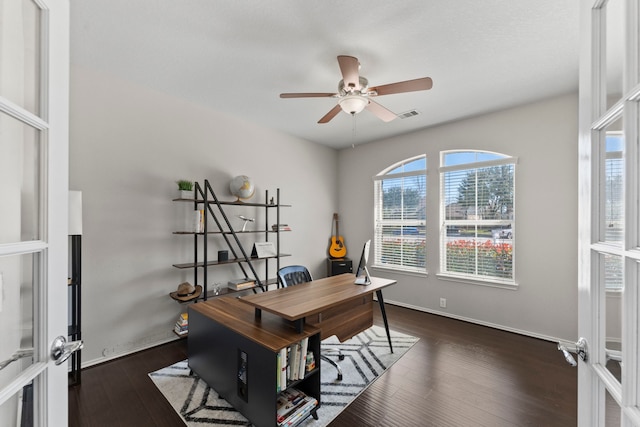 13815 Lake Livingston Dr, Houston, TX 77044 - home office with plenty of natural light, a ceiling fan, and dark wood-style flooring