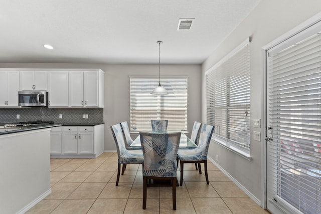 13815 Lake Livingston Dr, Houston, TX 77044 - dining space featuring light tile patterned floors and recessed lighting