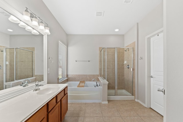 13815 Lake Livingston Dr, Houston, TX 77044 - bathroom featuring tile patterned flooring, vanity, a garden tub, and a shower stall