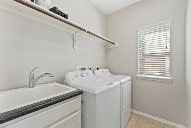 13815 Lake Livingston Dr, Houston, TX 77044 - laundry area featuring washer and dryer and light tile patterned floors