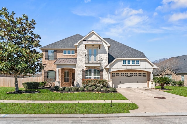 13815 Lake Livingston Dr, Houston, TX 77044 - french country style house featuring a shingled roof, driveway, stone siding, and a standing seam roof