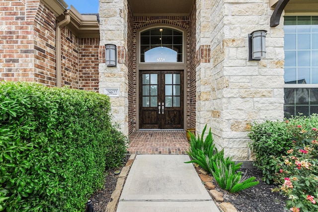 28622 Mountain Timber Ct, Fulshear, TX 77441 - property entrance with french doors and stone siding