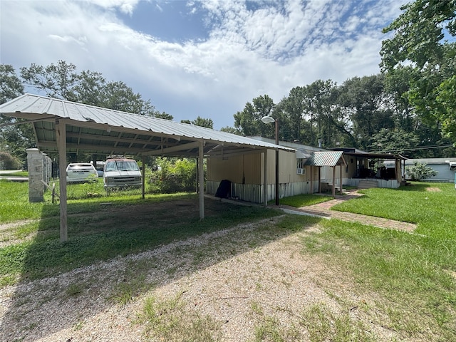 21061 Brazos Dr, New Caney, TX 77357 - view of car parking featuring driveway and a detached carport