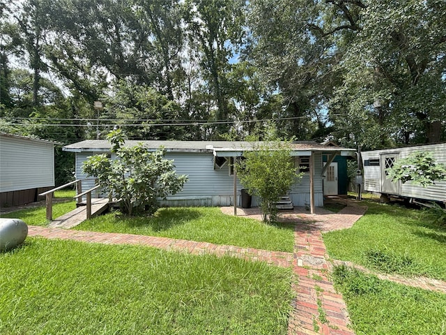 21061 Brazos Dr, New Caney, TX 77357 - view of front facade featuring a front lawn