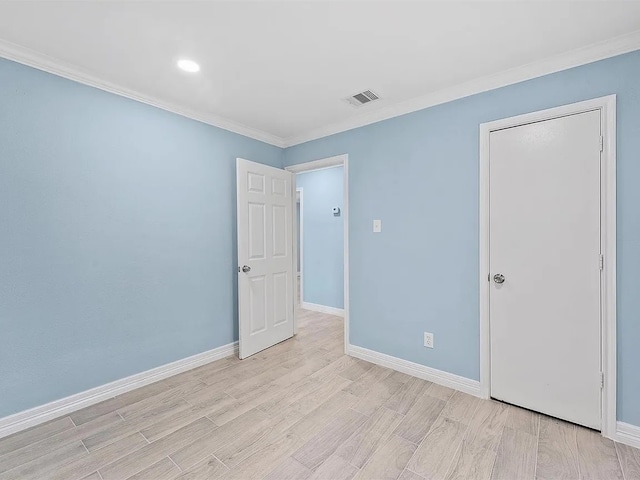 4418 Dacca Dr, Houston, TX 77047 - unfurnished bedroom with crown molding, light wood finished floors, and recessed lighting