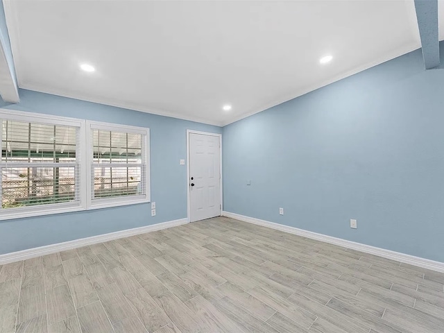 4418 Dacca Dr, Houston, TX 77047 - empty room featuring light wood-style flooring, crown molding, and recessed lighting