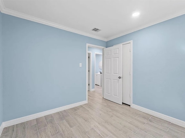 4418 Dacca Dr, Houston, TX 77047 - spare room featuring light wood-style flooring, ornamental molding, and recessed lighting