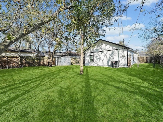 4418 Dacca Dr, Houston, TX 77047 - fenced backyard featuring a storage unit
