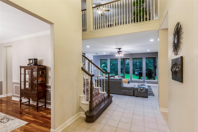 14419 Timbergreen Dr, Magnolia, TX 77355 - stairs with a ceiling fan, crown molding, wood finished floors, a towering ceiling, and recessed lighting
