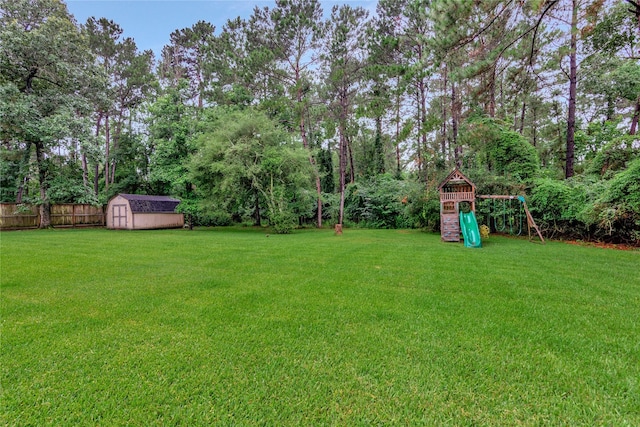 14419 Timbergreen Dr, Magnolia, TX 77355 - view of yard with a playground and a shed