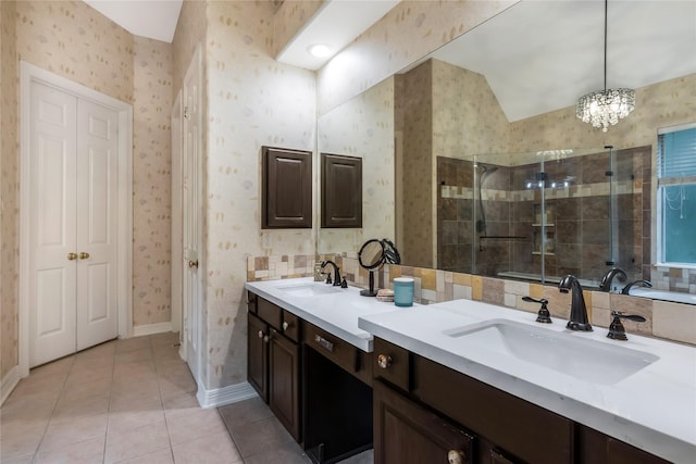 14419 Timbergreen Dr, Magnolia, TX 77355 - bathroom with double vanity, a stall shower, wallpapered walls, tile patterned floors, and a chandelier
