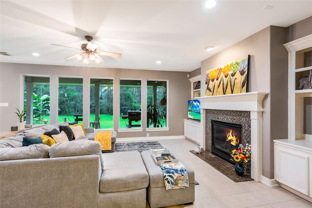 14419 Timbergreen Dr, Magnolia, TX 77355 - living area with recessed lighting, a ceiling fan, a tile fireplace, and light tile patterned flooring