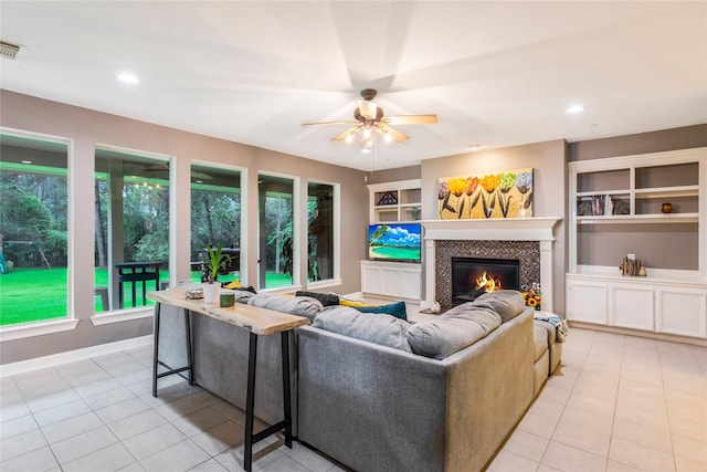 14419 Timbergreen Dr, Magnolia, TX 77355 - living room featuring a ceiling fan, a fireplace, light tile patterned flooring, and recessed lighting
