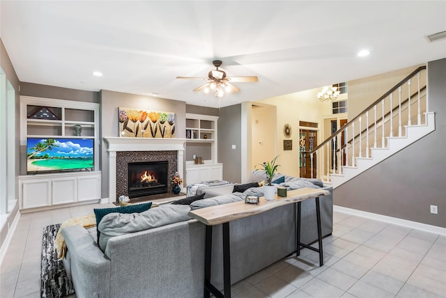14419 Timbergreen Dr, Magnolia, TX 77355 - living area featuring light tile patterned flooring, a tile fireplace, stairway, a ceiling fan, and recessed lighting