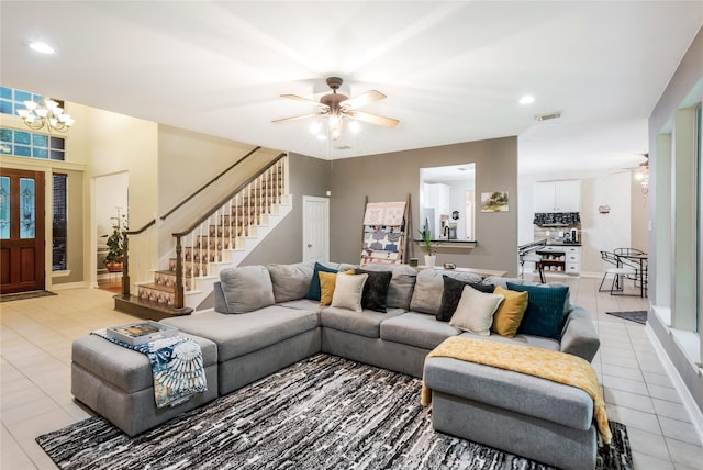14419 Timbergreen Dr, Magnolia, TX 77355 - living area with light tile patterned floors, a ceiling fan, a chandelier, stairs, and recessed lighting