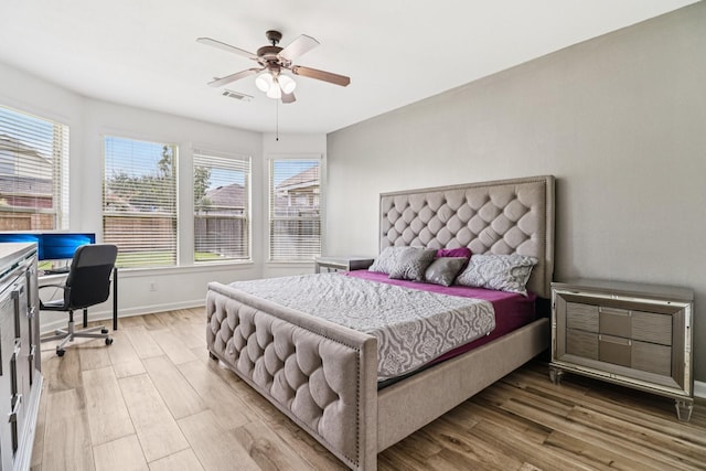 4003 Autumn Pines Trl, Houston, TX 77084 - bedroom featuring an office area, light wood finished floors, and ceiling fan