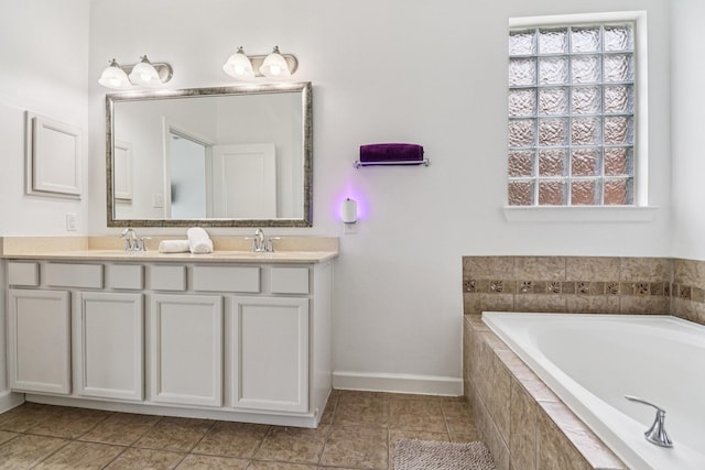 4003 Autumn Pines Trl, Houston, TX 77084 - bathroom featuring double vanity, a garden tub, and tile patterned floors