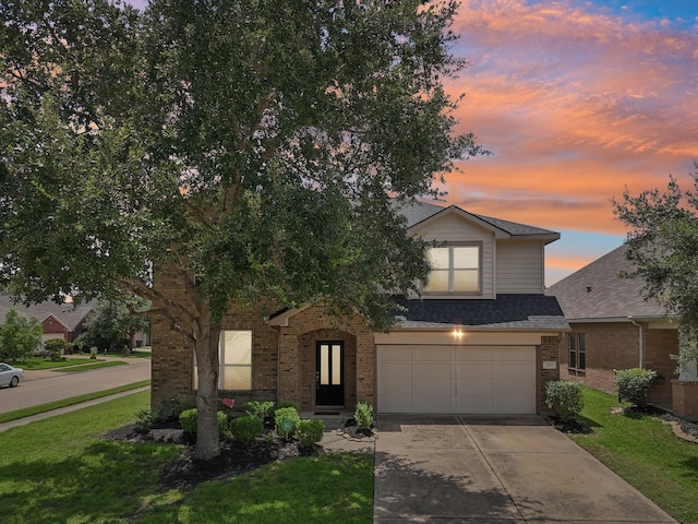4003 Autumn Pines Trl, Houston, TX 77084 - view of front of house with brick siding, an attached garage, driveway, roof with shingles, and a front yard