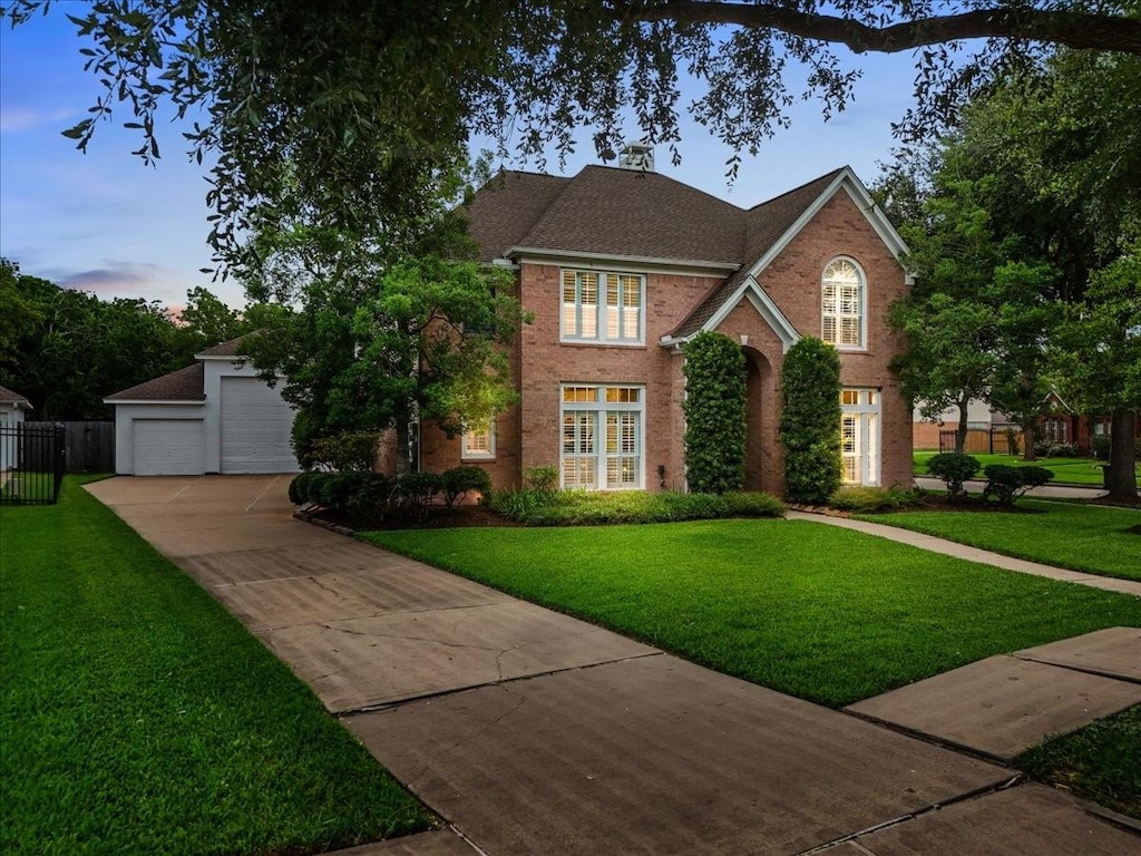 3206 Sand Shadow Ct, League City, TX 77573 - view of front of home featuring a garage, brick siding, driveway, and a shingled roof