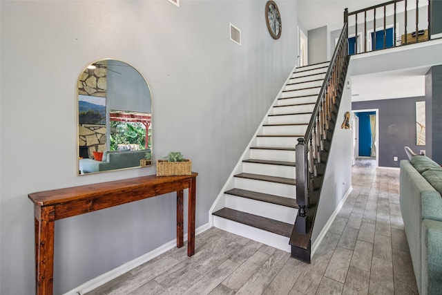 5210 Creek Shadows Dr, Houston, TX 77339 - staircase featuring wood finished floors and a high ceiling
