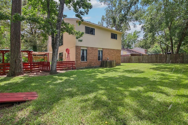 5210 Creek Shadows Dr, Houston, TX 77339 - back of house featuring brick siding and a fenced backyard