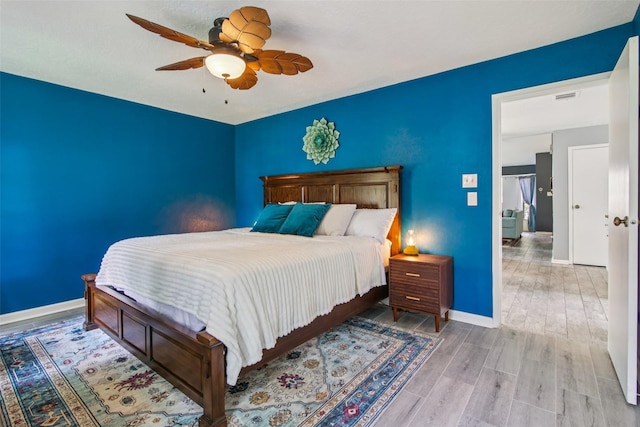 5210 Creek Shadows Dr, Houston, TX 77339 - bedroom featuring wood finished floors and ceiling fan