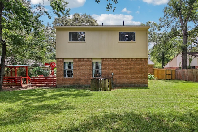 5210 Creek Shadows Dr, Houston, TX 77339 - rear view of property featuring brick siding and a fenced backyard