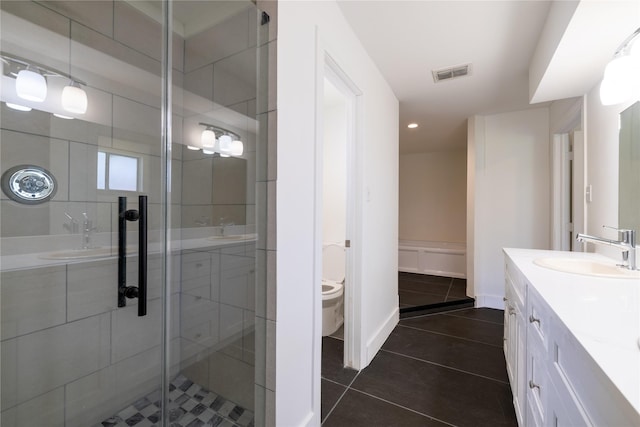 10602 Tenneta Dr, Houston, TX 77099 - full bathroom with a stall shower, vanity, tile patterned flooring, and recessed lighting