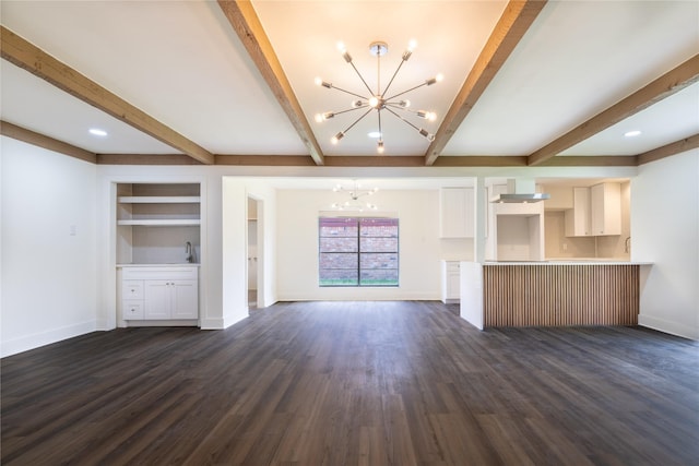 10602 Tenneta Dr, Houston, TX 77099 - unfurnished living room featuring a chandelier, dark wood-style floors, beam ceiling, and built in shelves